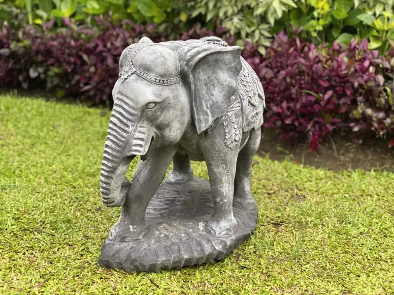 Product image of the product “Avan - Elephant with blanket, looking to the right. 63 cm L | cast stone ”
