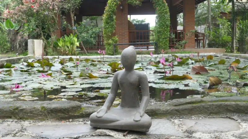 Product image of the product “Sitting woman in yoga position - lotus position, 30cm high. Cast stone, handcrafted & colored 30 cm”